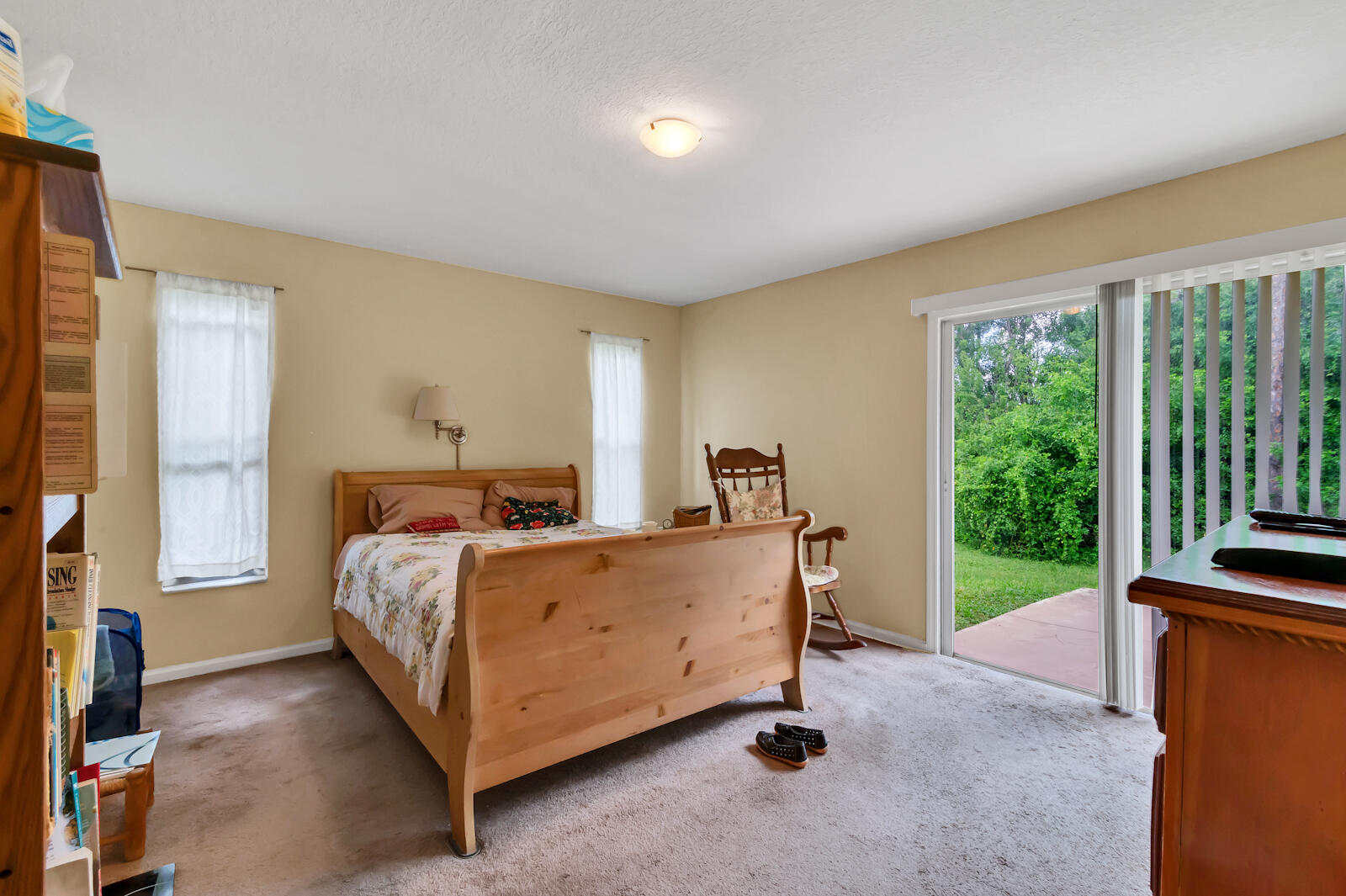 4091 Mandarin Boulevard Loxahatchee, FL 33470 - Photo 22 of 31 a bed sitting in a room next to a window