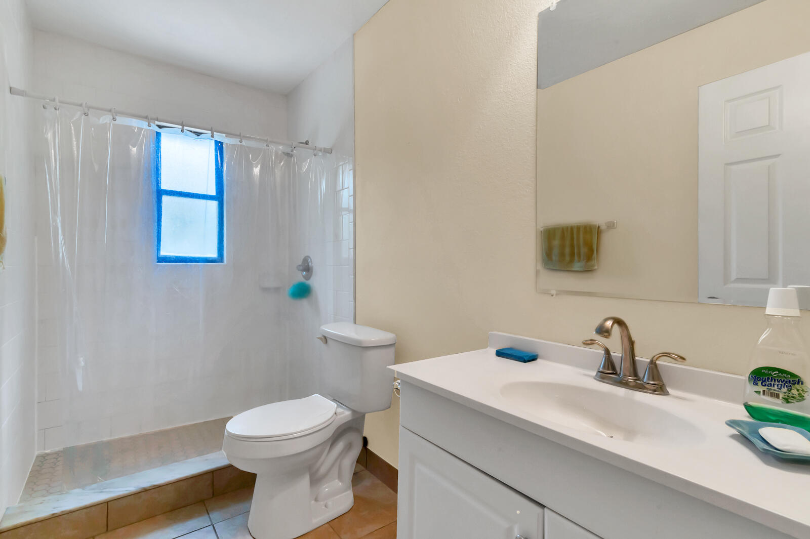 4091 Mandarin Boulevard Loxahatchee, FL 33470 - Photo 24 of 31 a bathroom with a sink toilet and mirror