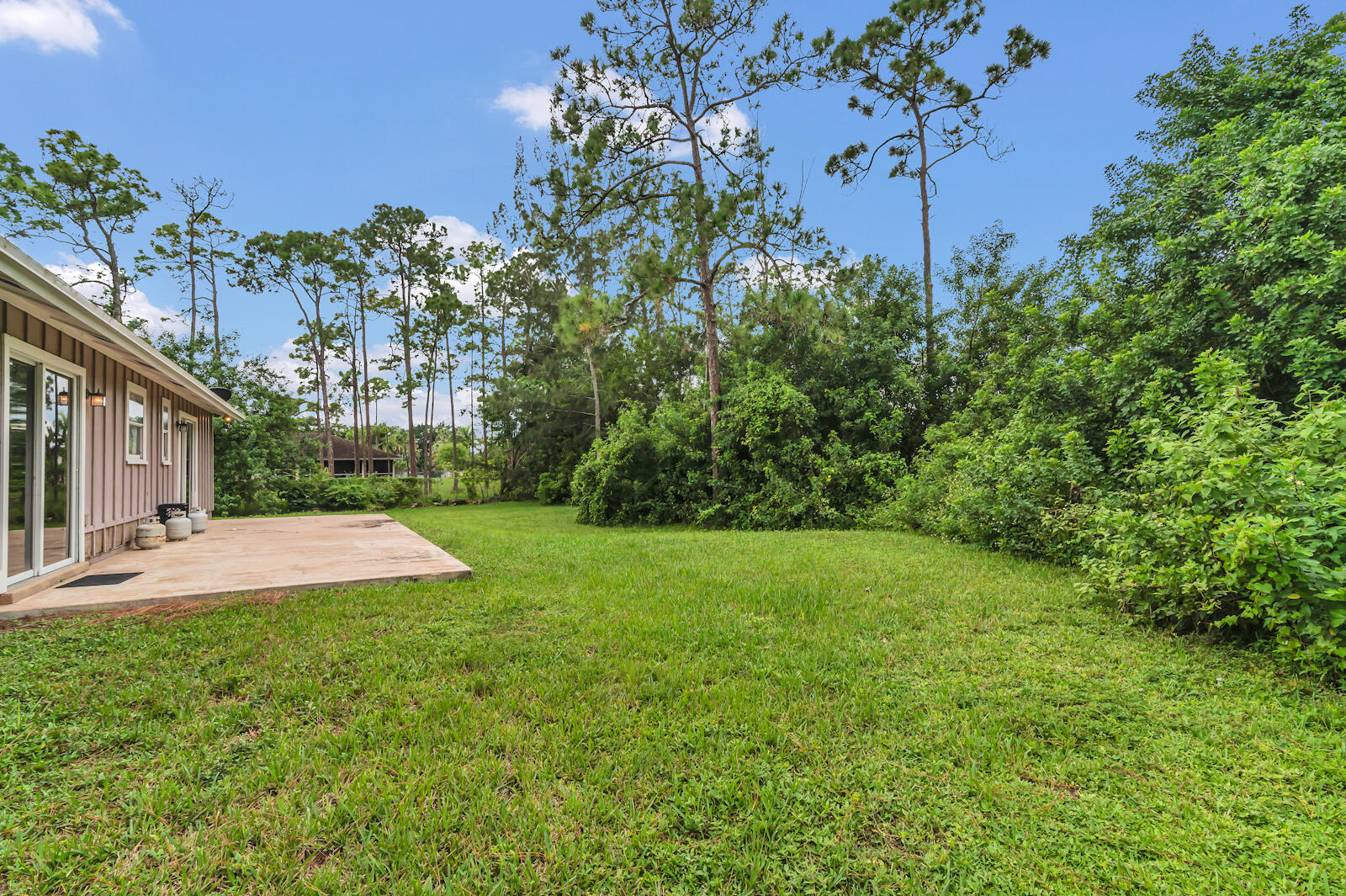 4091 Mandarin Boulevard Loxahatchee, FL 33470 - Photo 26 of 31 a view of a backyard with a garden