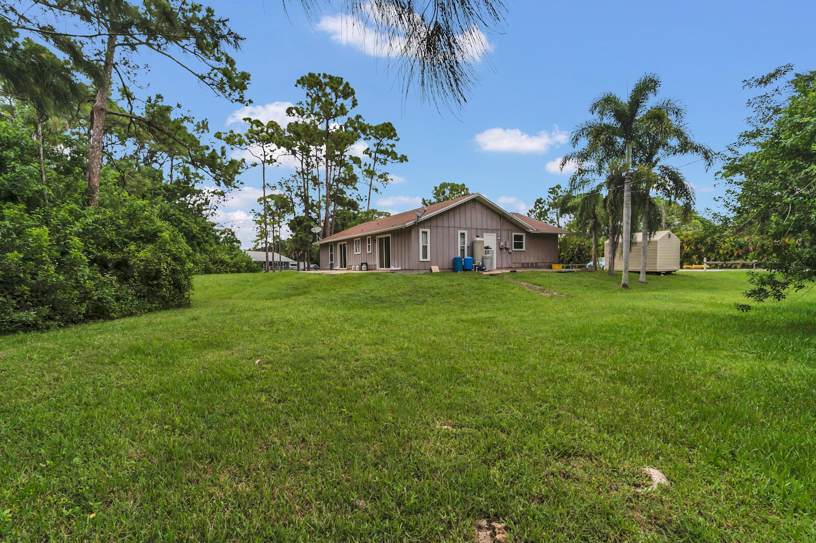 4091 Mandarin Boulevard Loxahatchee, FL 33470 - Photo 27 of 31 a view of a house with a yard