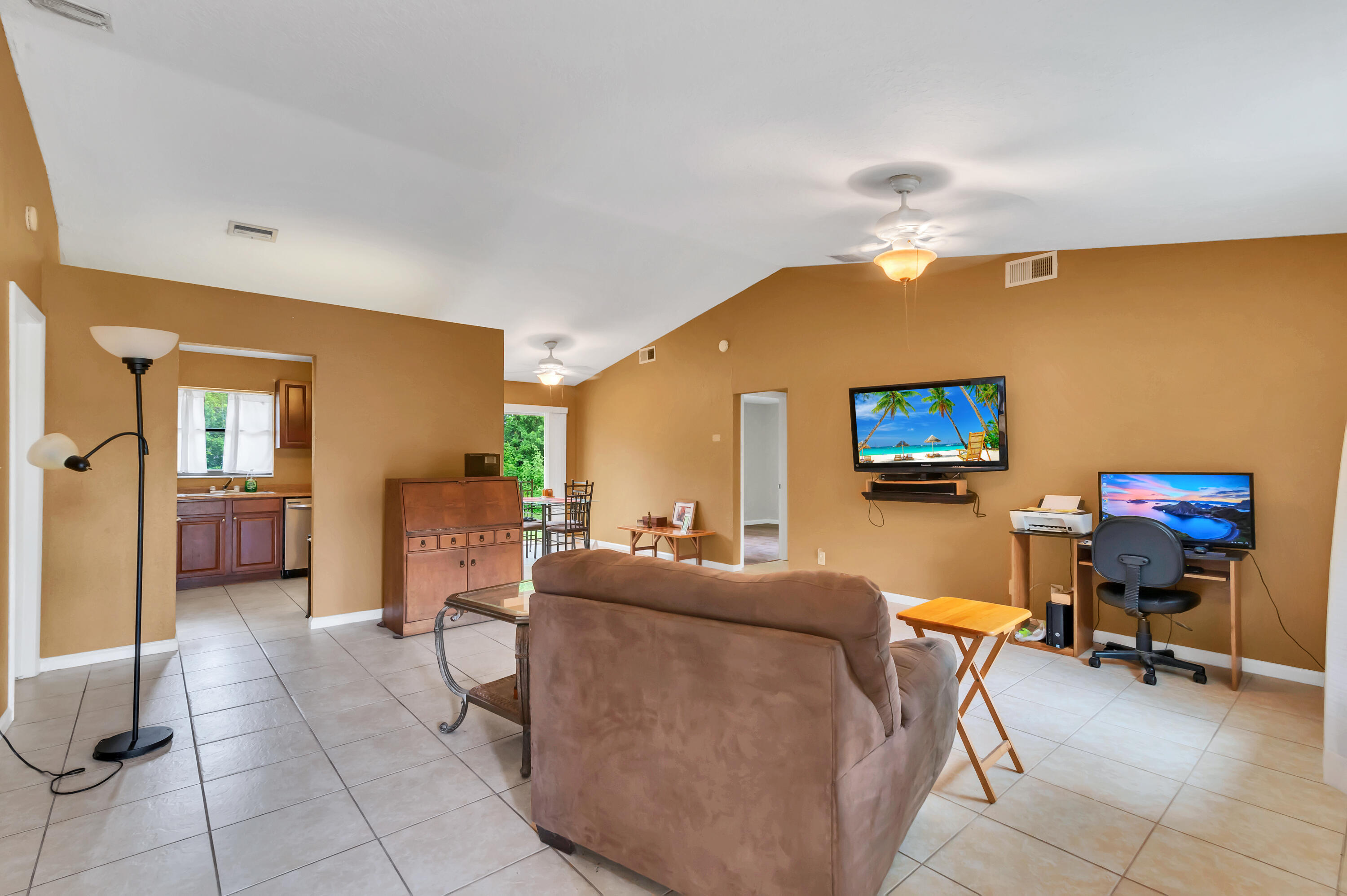 4091 Mandarin Boulevard Loxahatchee, FL 33470 - Photo 5 of 31 a living room with furniture and a flat screen tv