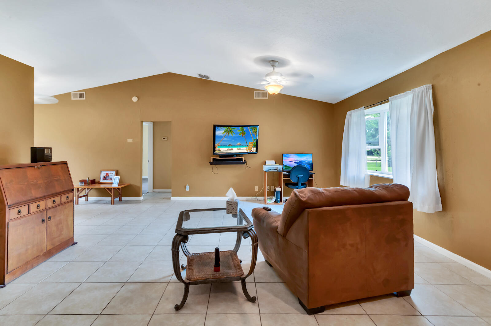 4091 Mandarin Boulevard Loxahatchee, FL 33470 - Photo 6 of 31 a living room with furniture and a window