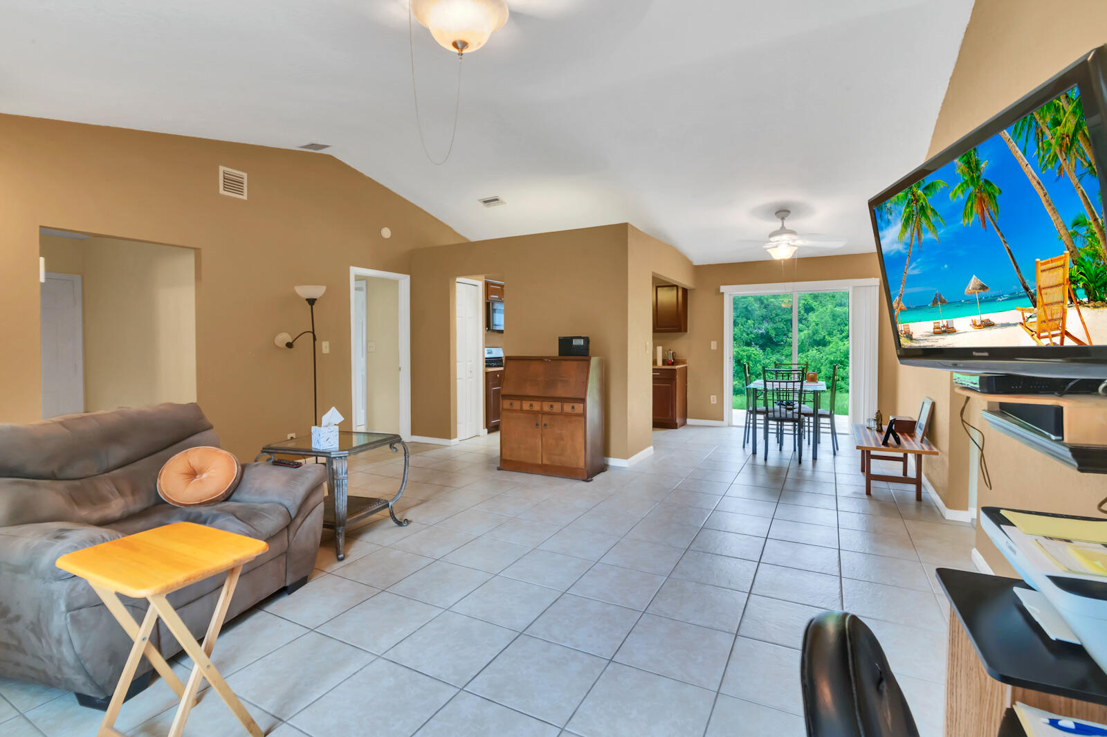 4091 Mandarin Boulevard Loxahatchee, FL 33470 - Photo 8 of 31 a room with furniture and a flat screen tv