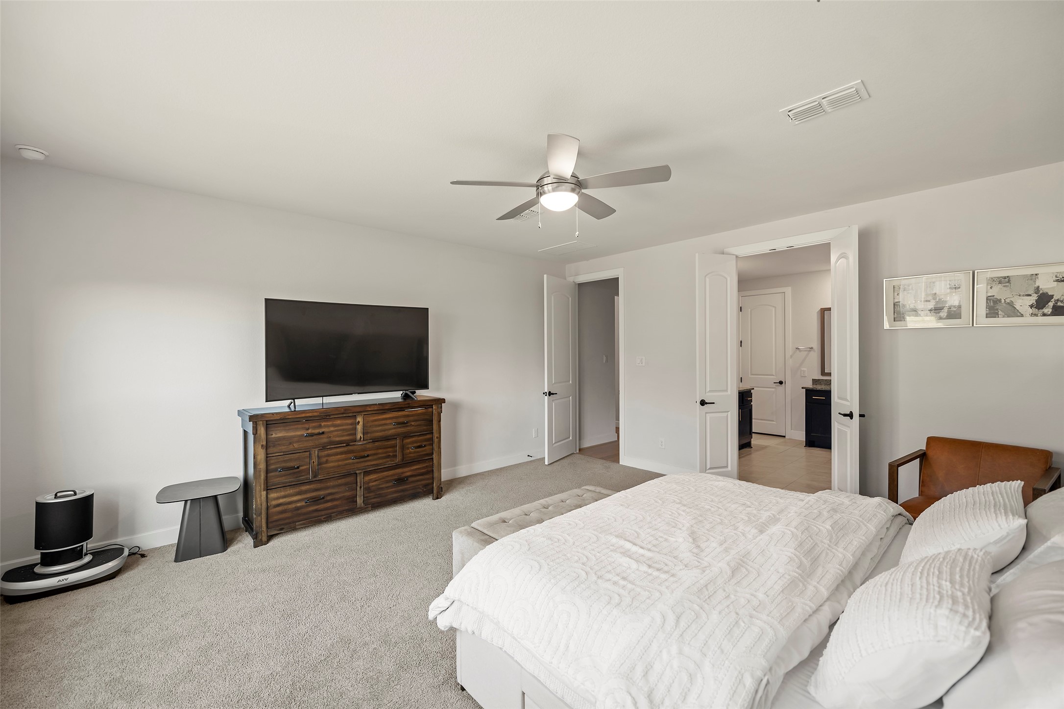 4802 Pecos Ridge Lane Sugar Land, TX 77479 - Photo 20 of 48 a bedroom with a bed and a flat screen tv