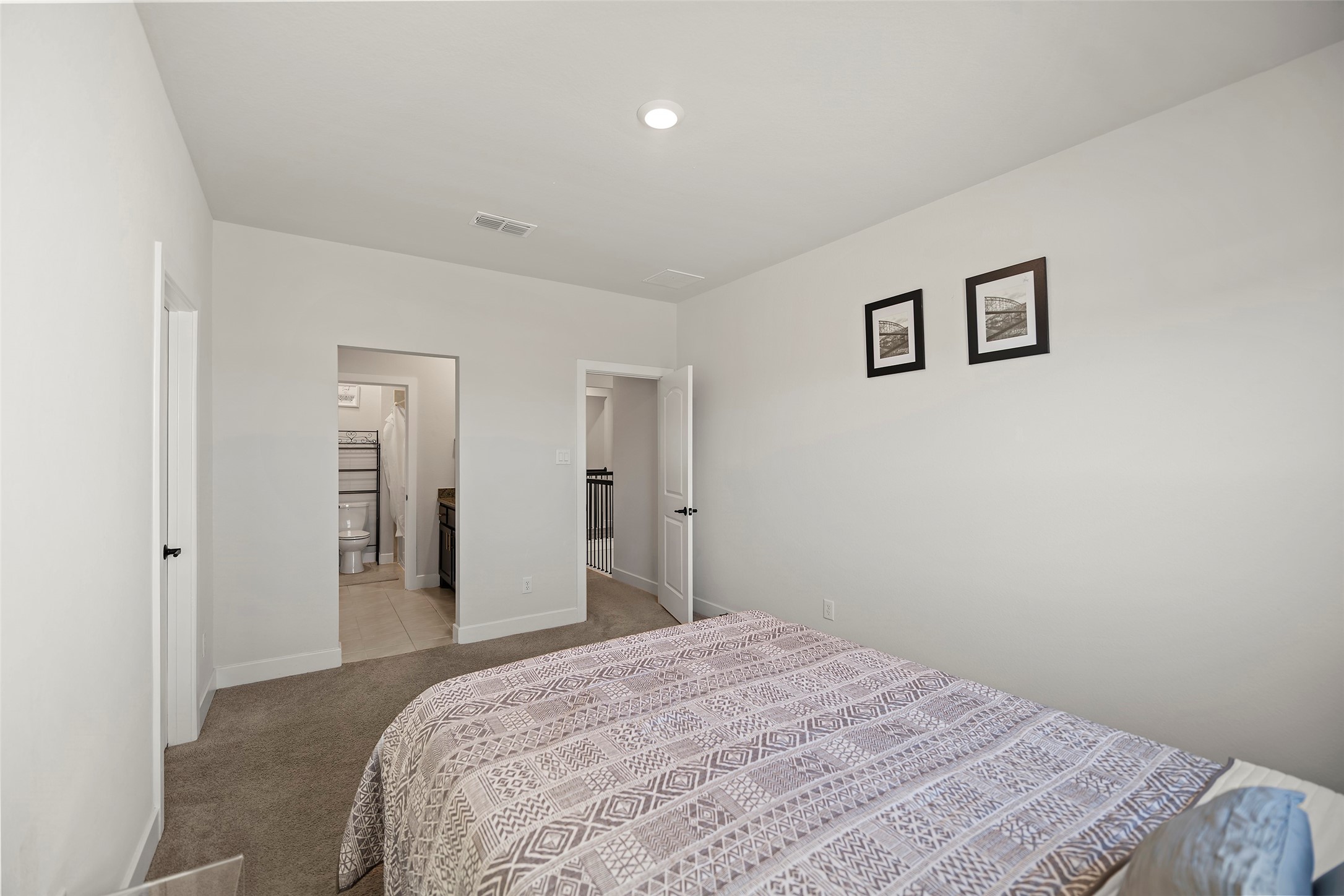 4802 Pecos Ridge Lane Sugar Land, TX 77479 - Photo 31 of 48 a bedroom with a bed and painting on the wall