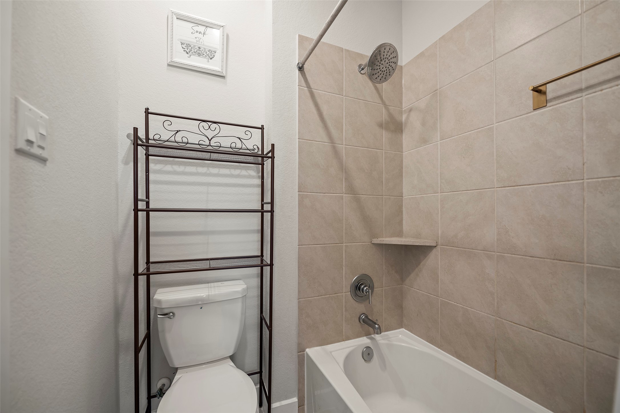 4802 Pecos Ridge Lane Sugar Land, TX 77479 - Photo 33 of 48 a bathroom with a toilet a sink and bathtub