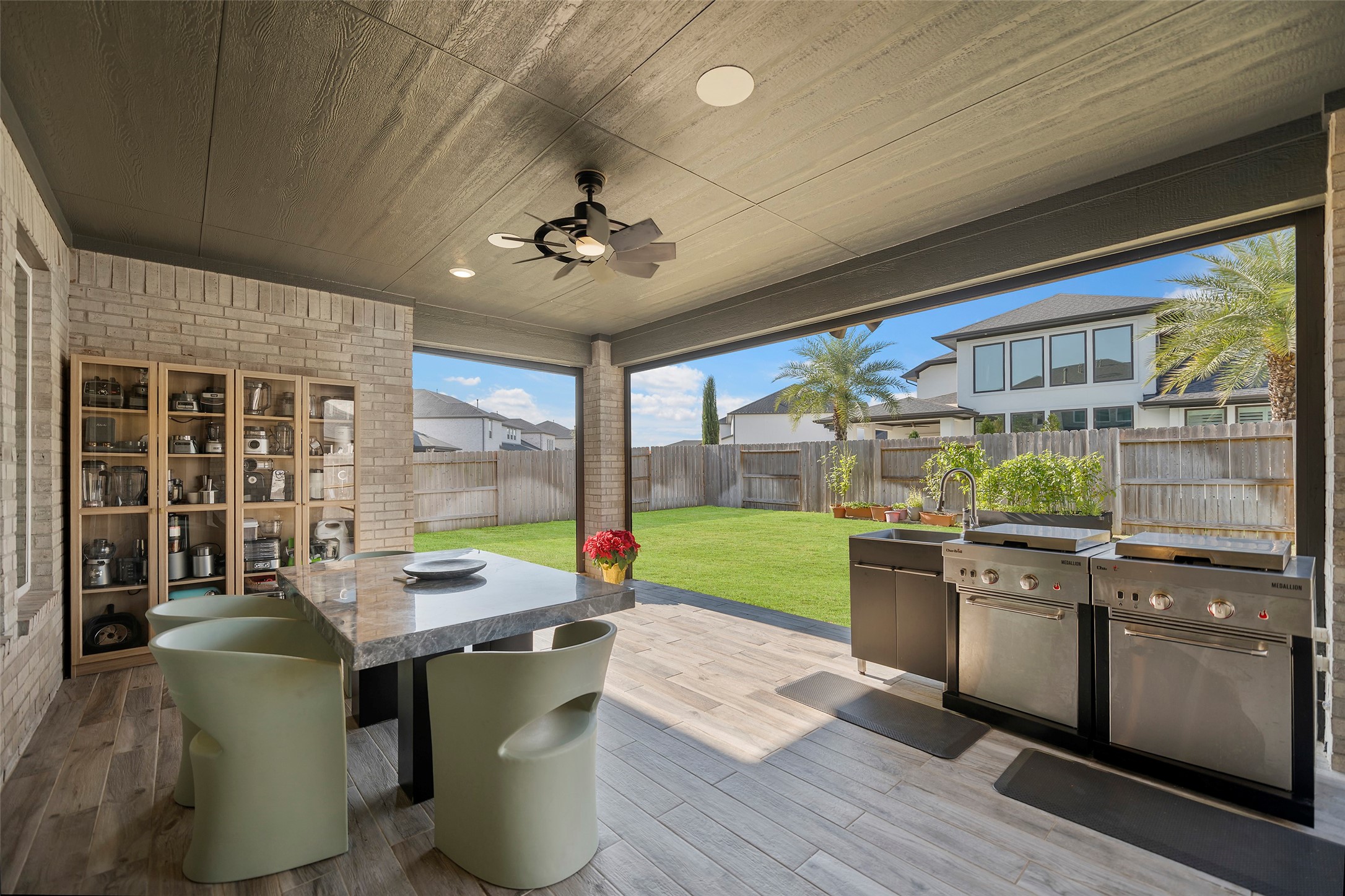 4802 Pecos Ridge Lane Sugar Land, TX 77479 - Photo 40 of 48 a view of a dining room with furniture large windows and wooden floor