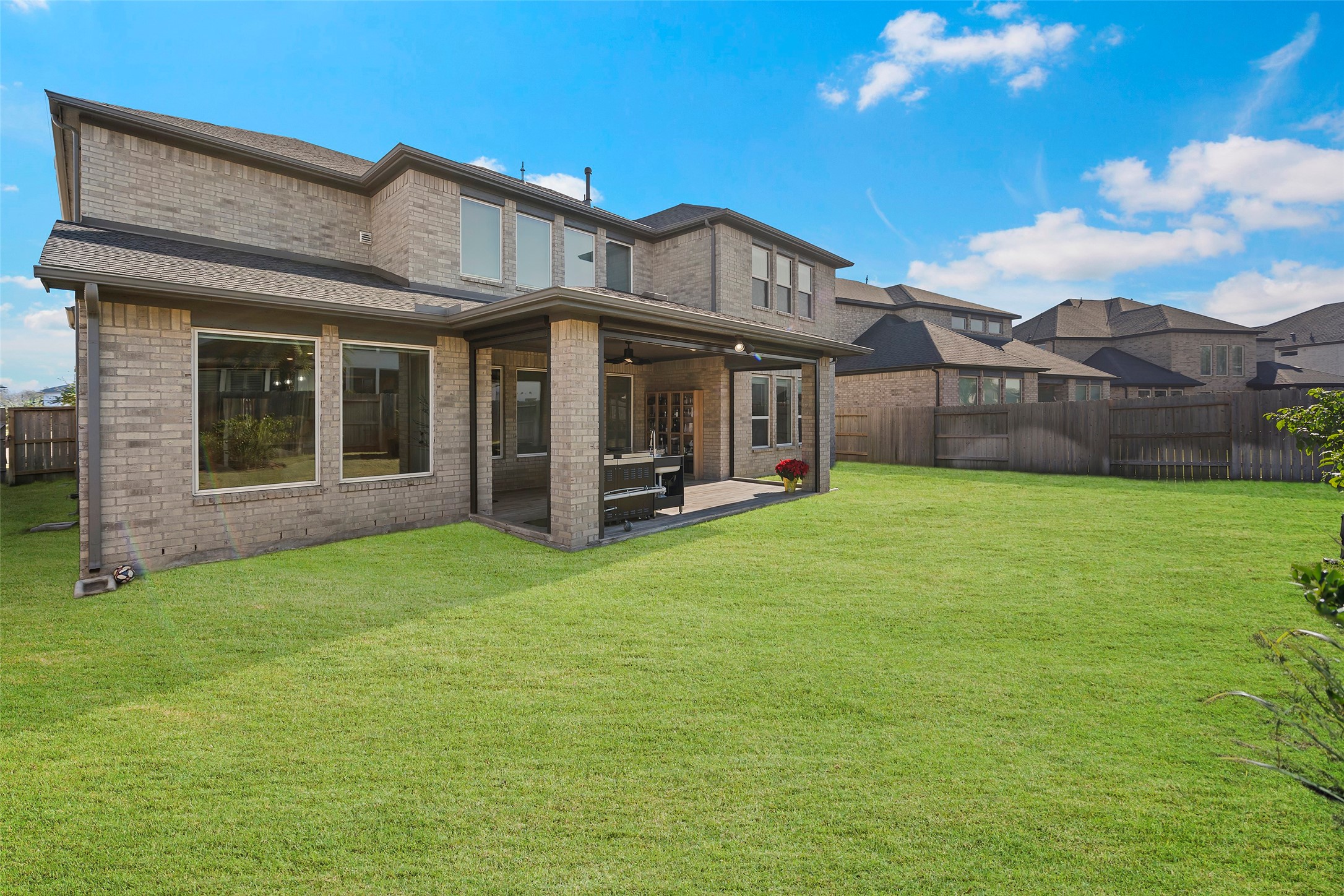 4802 Pecos Ridge Lane Sugar Land, TX 77479 - Photo 44 of 48 a view of a house with a yard