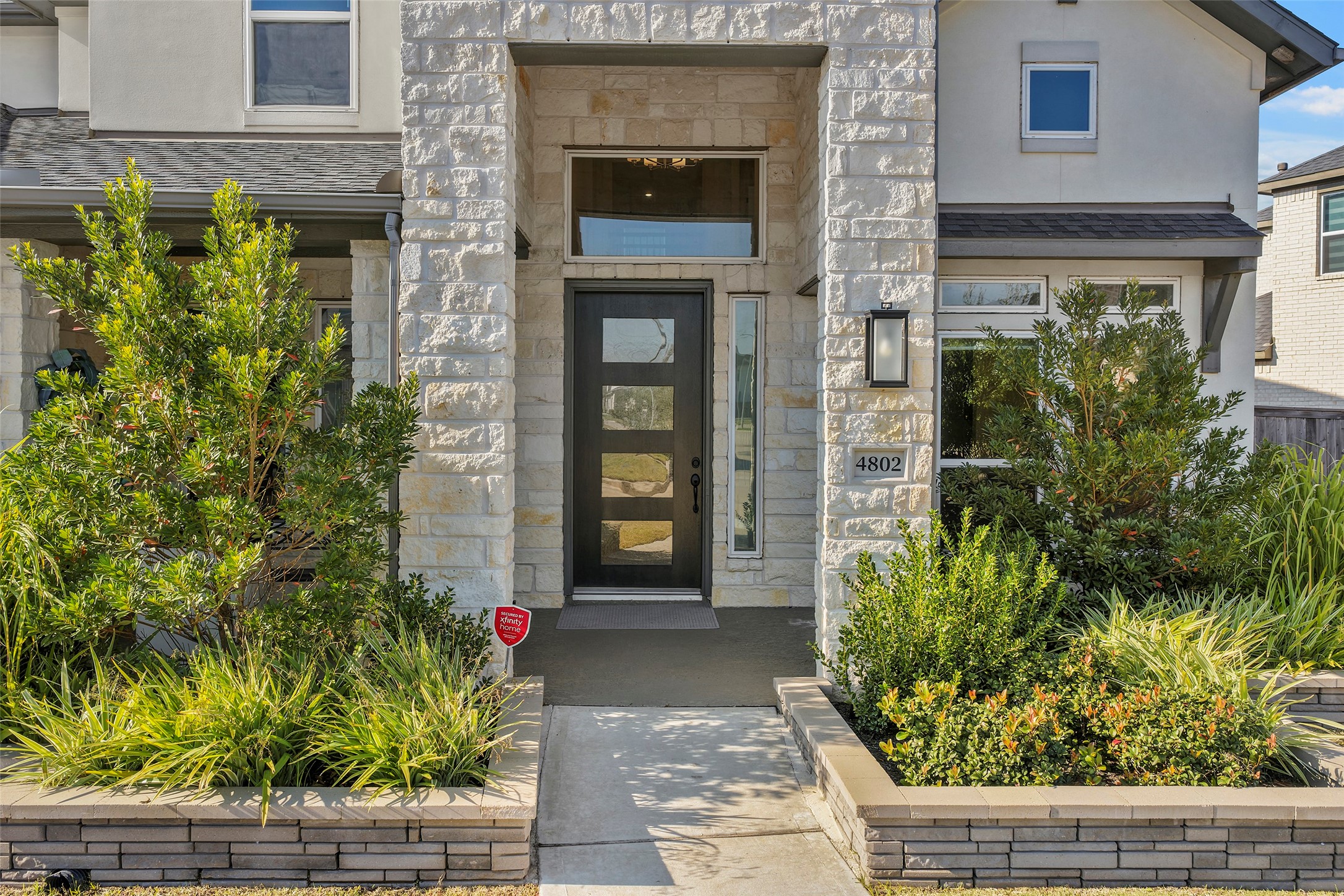 4802 Pecos Ridge Lane Sugar Land, TX 77479 - Photo 5 of 48 a front view of a house with garden