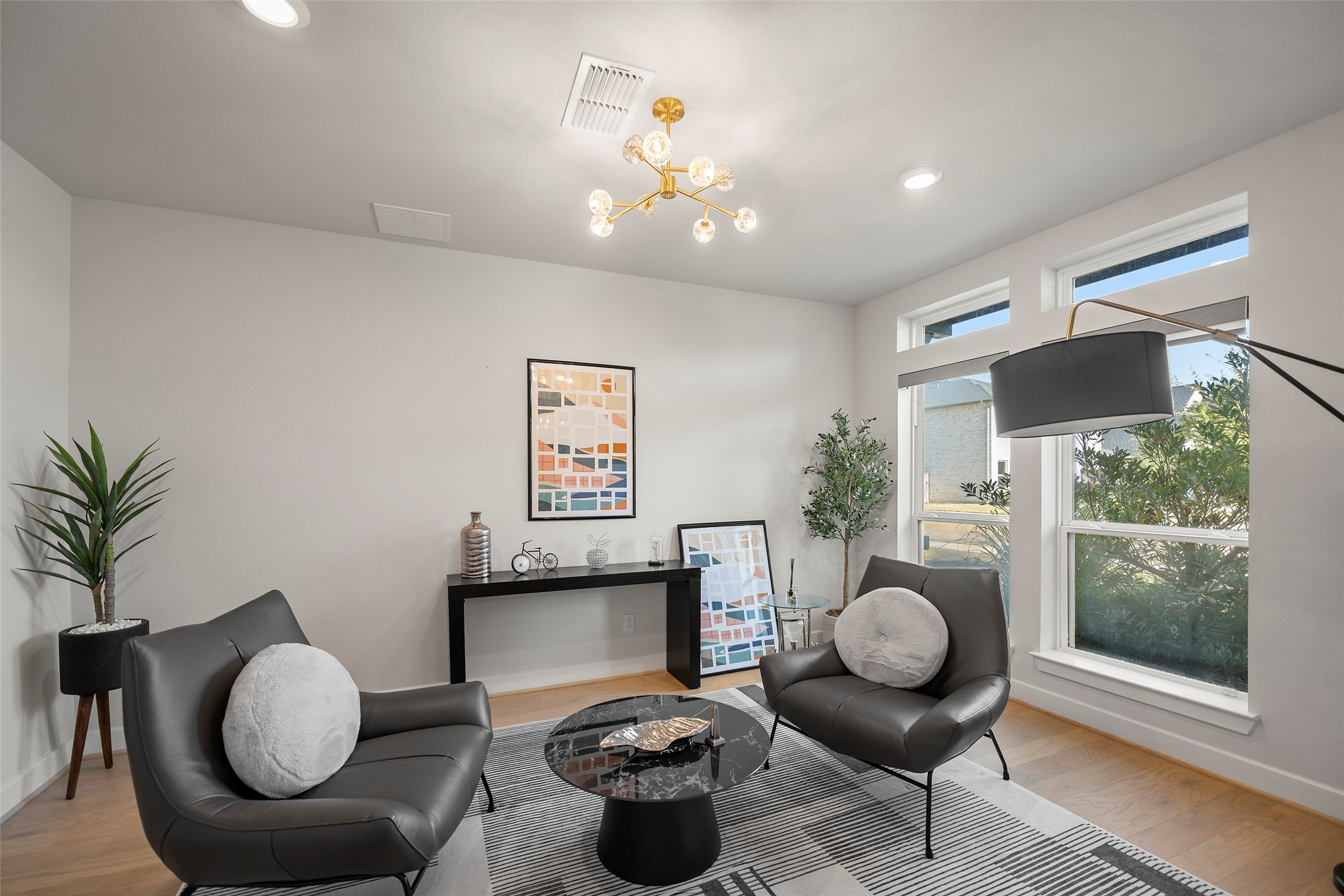 4802 Pecos Ridge Lane Sugar Land, TX 77479 - Photo 10 of 48 a living room with furniture and a floor to ceiling window