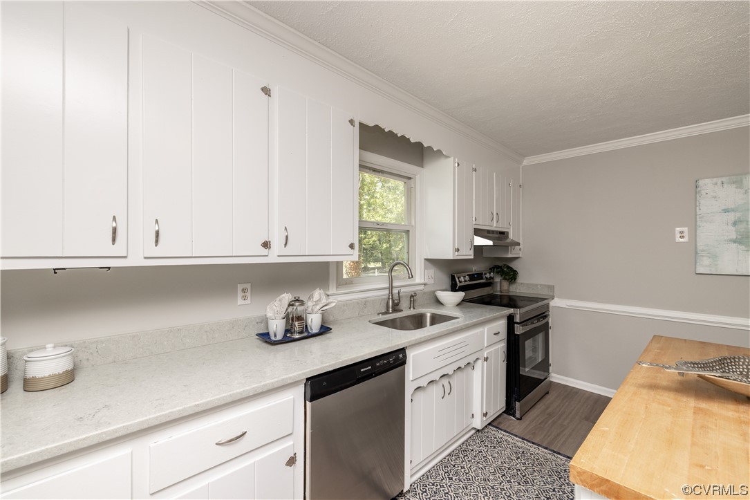 4531 Crossgate Road Chester, VA 23831 - Photo 15 of 37 a kitchen with stainless steel appliances granite countertop a sink stove and cabinets