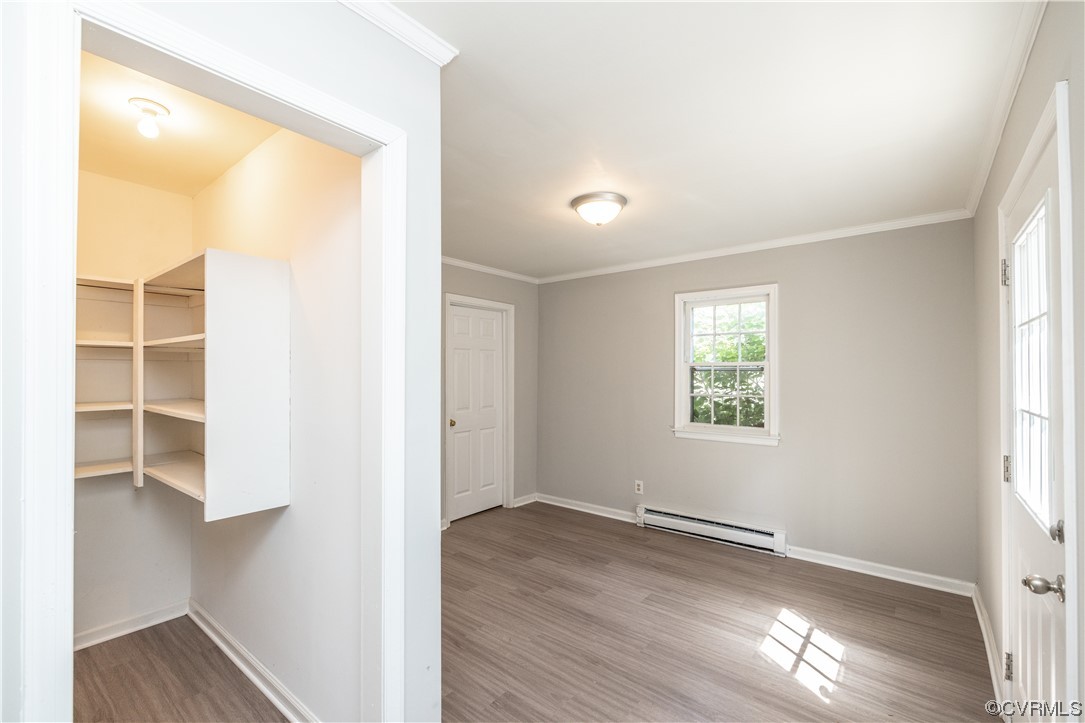4531 Crossgate Road Chester, VA 23831 - Photo 17 of 37 an empty room with wooden floor and windows