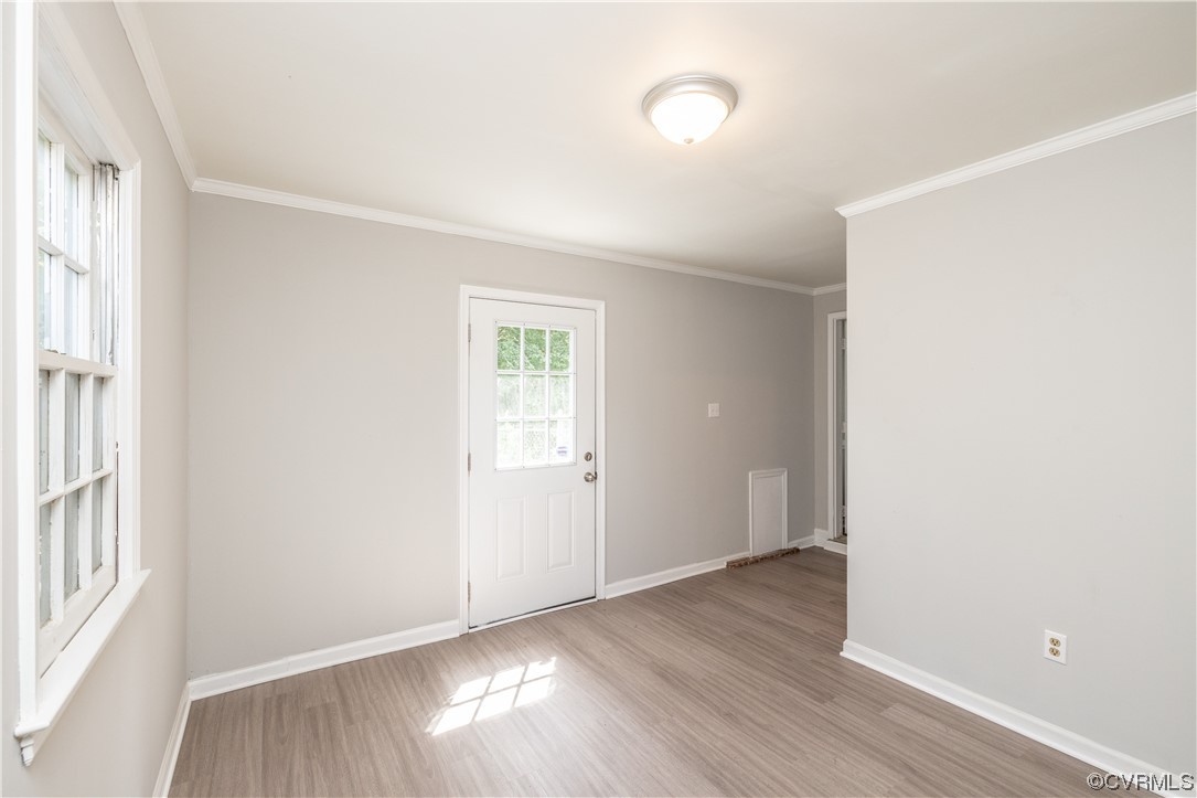 4531 Crossgate Road Chester, VA 23831 - Photo 19 of 37 an empty room with wooden floor and windows