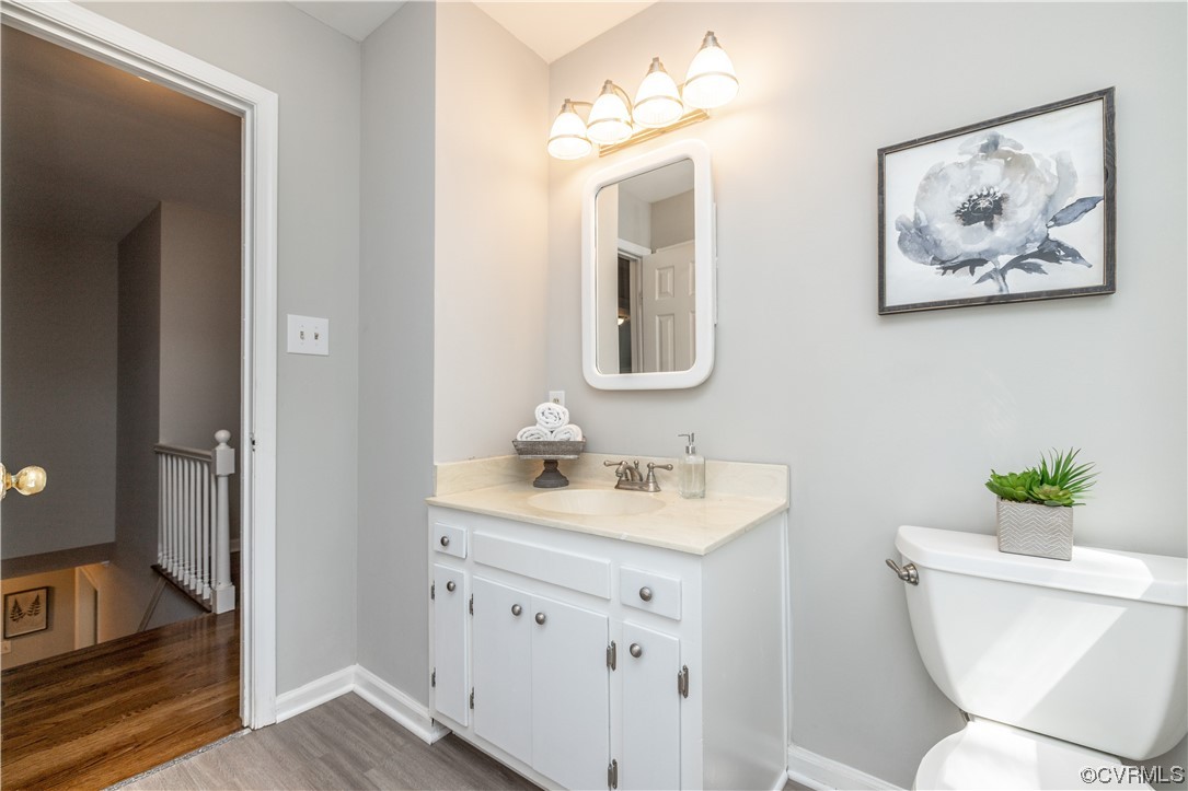 4531 Crossgate Road Chester, VA 23831 - Photo 28 of 37 a bathroom with a toilet sink and mirror