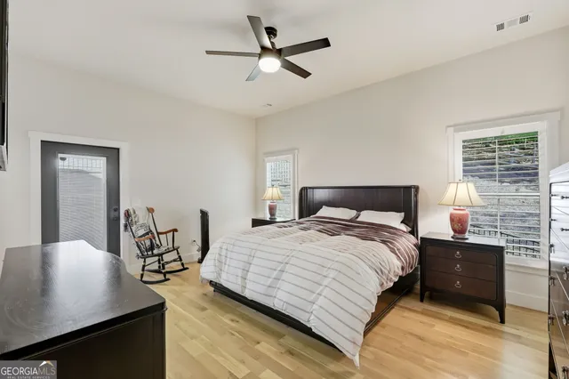 a bedroom with a bed and a table