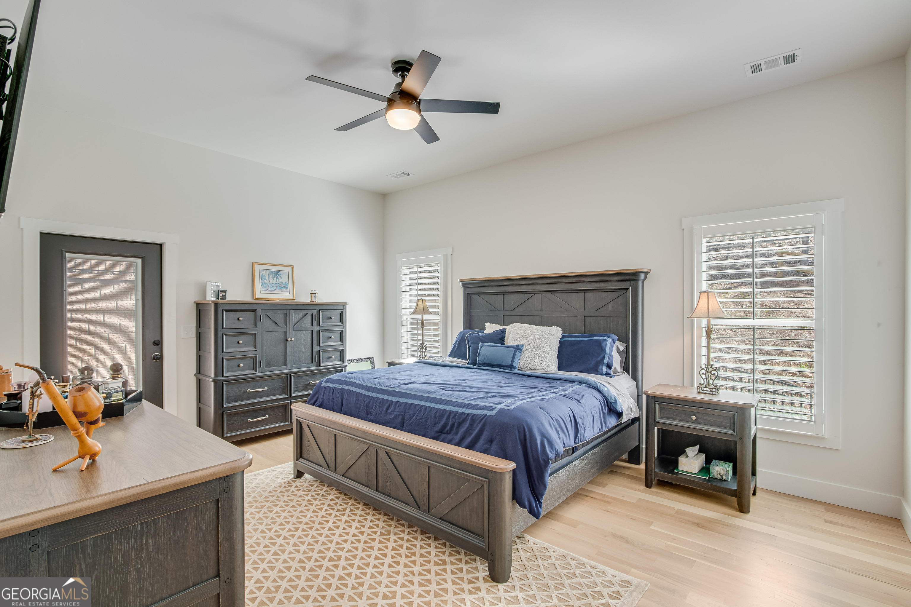 804 Wilshire Road Gainesville, GA 30501 - Photo 16 of 41 a bedroom with a bed and a chandelier