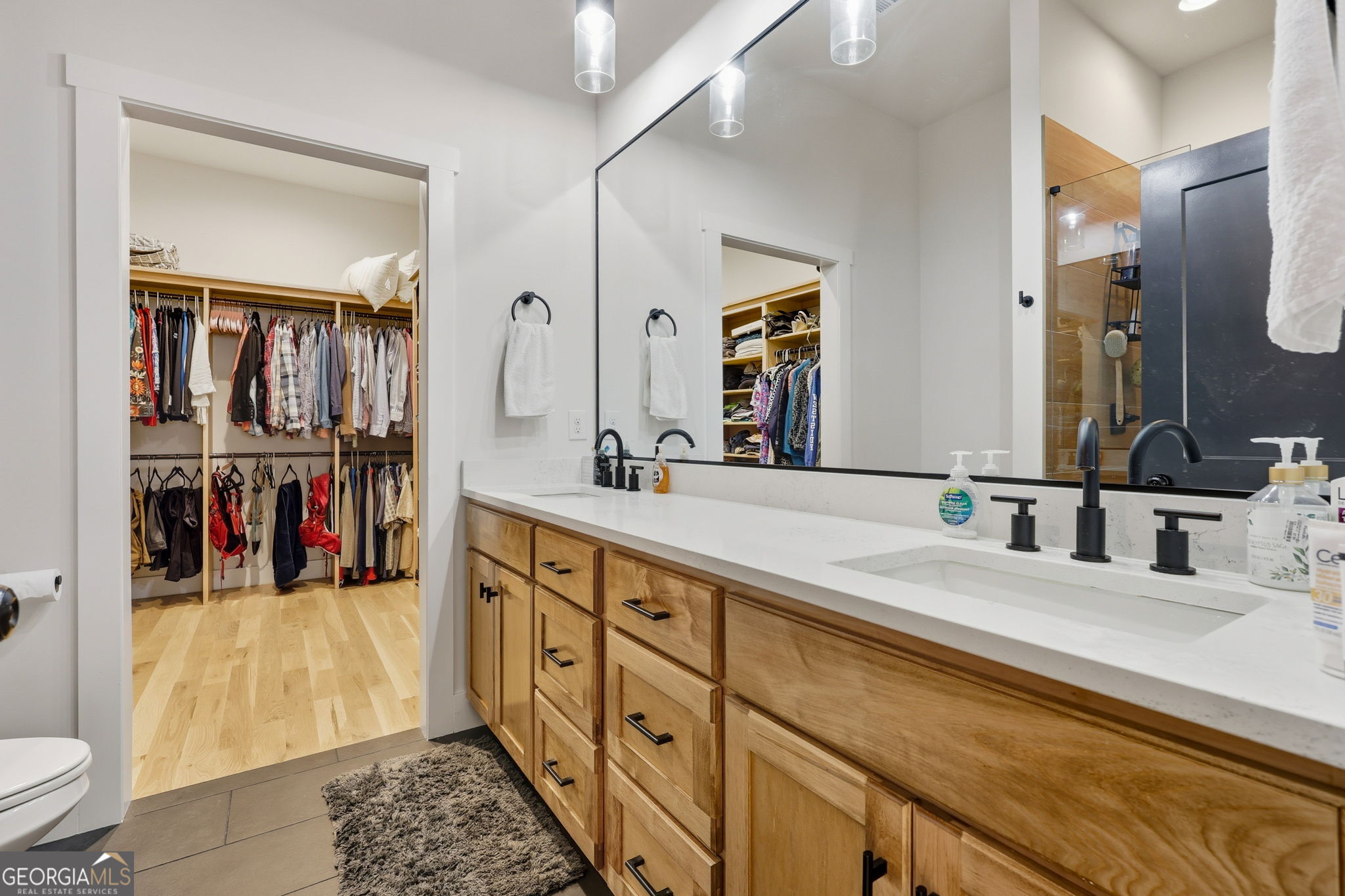 804 Wilshire Road Gainesville, GA 30501 - Photo 17 of 41 a bathroom with a double vanity sink and a mirror
