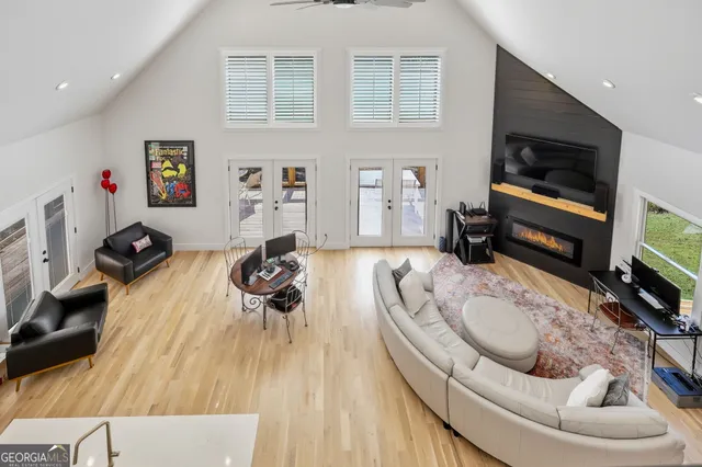 a living room with furniture and a flat screen tv