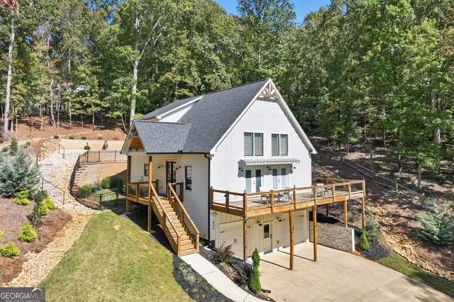 a view of a house with pool and sitting area