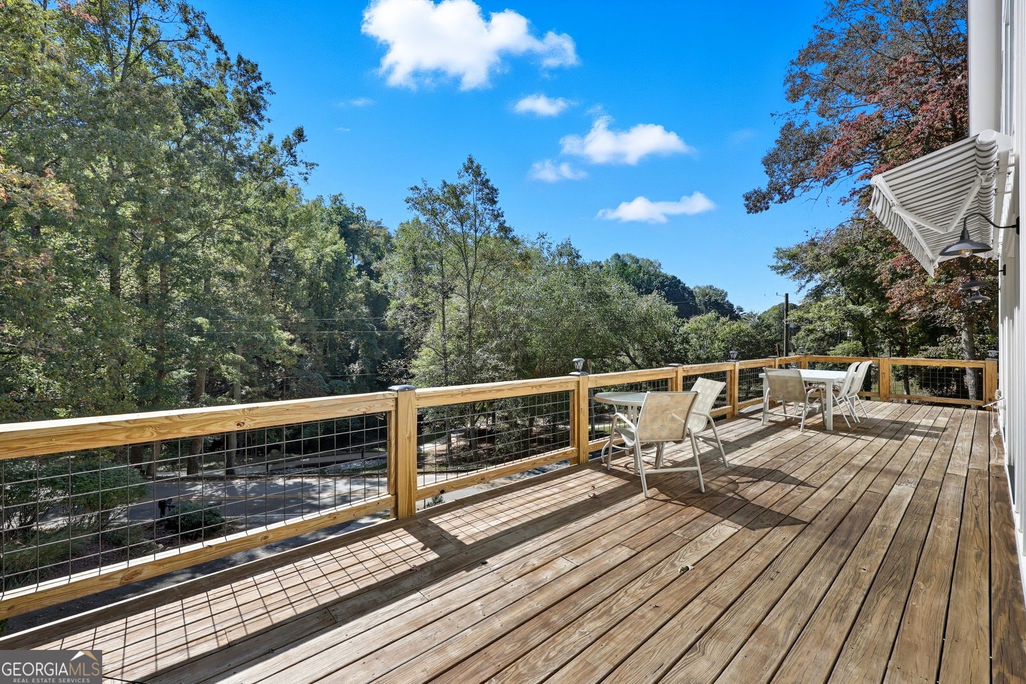 804 Wilshire Road Gainesville, GA 30501 - Photo 30 of 41 a view of balcony with wooden floor and trees