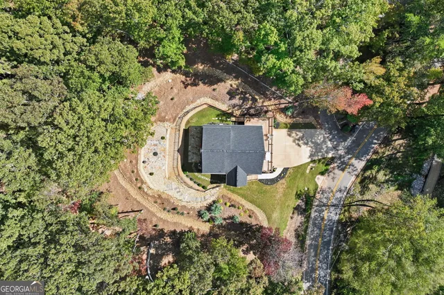 a view of a backyard with wooden fence