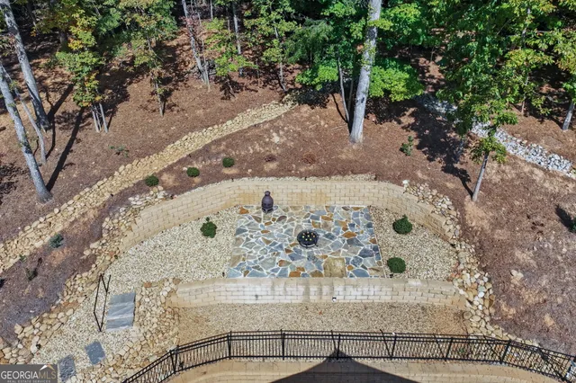 a view of a backyard with sitting area