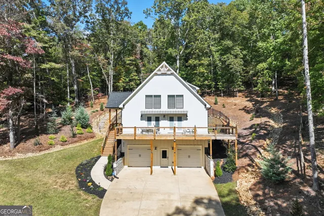 a view of a house with roof and sitting area