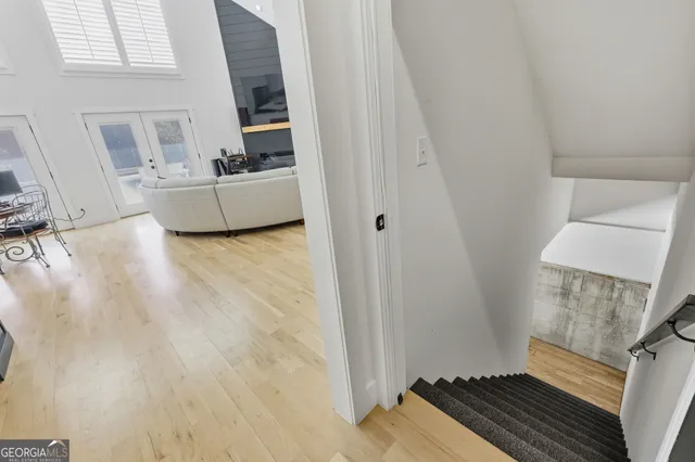 a view of a livingroom with furniture and a window