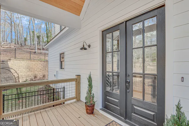 a view of a balcony with wooden floor