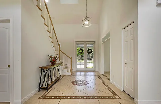 a view of a dining room with furniture wooden floor and chandelier