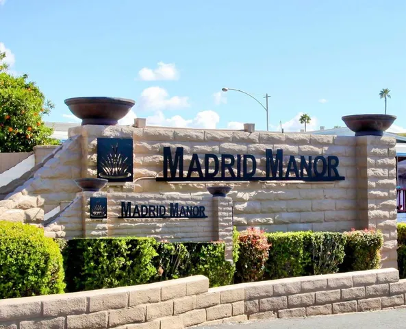 a view of a balcony with wooden fence