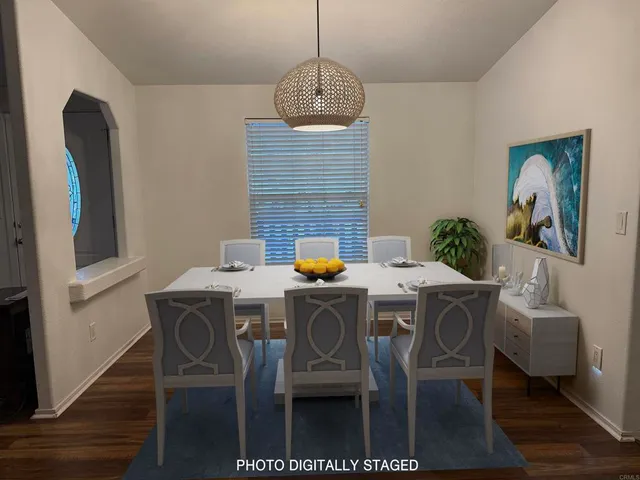 a dining room with furniture and window