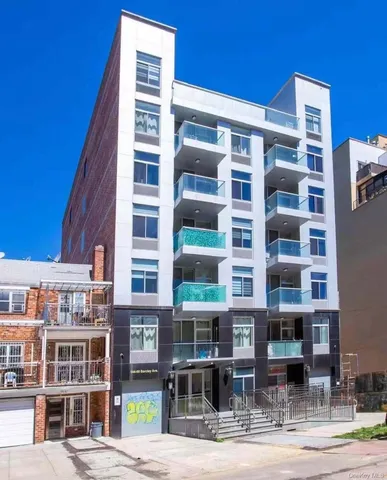 a front view of a building with glass windows