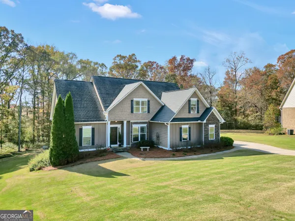 a front view of a house with a yard