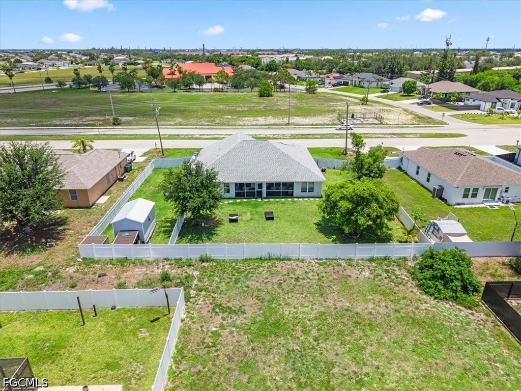 22 Nelson Road South Cape Coral, FL 33991 - Photo 41 of 43 an aerial view of a houses with an outdoor space and seating area