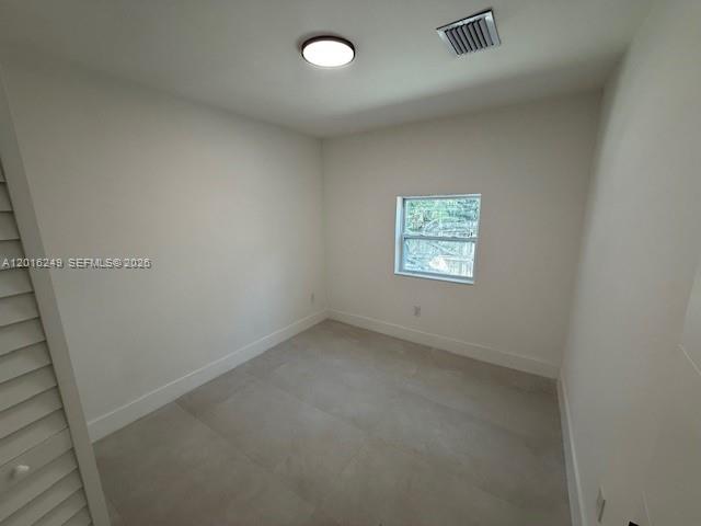 328 Northeast 57th Street Miami, FL 33137 - Photo 11 of 16 an empty room with windows