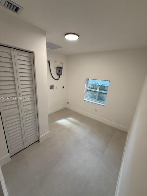 328 Northeast 57th Street Miami, FL 33137 - Photo 6 of 16 an empty room with windows