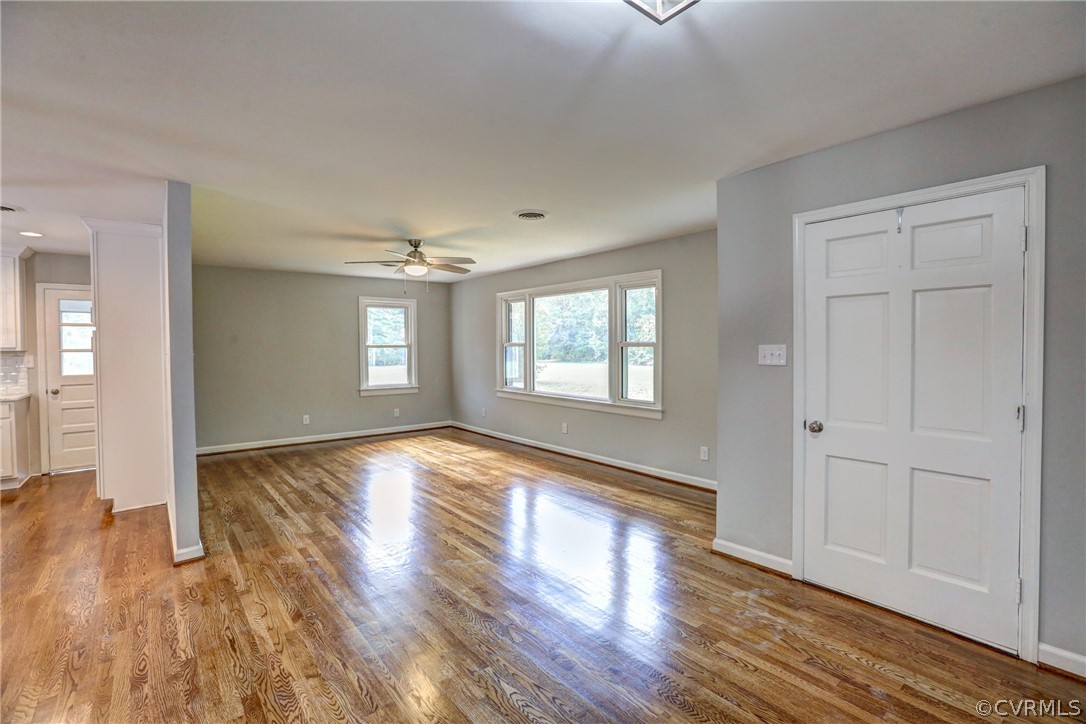 1820 Hawk Town Road Maidens, VA 23102 - Photo 12 of 46 an empty room with wooden floor and windows