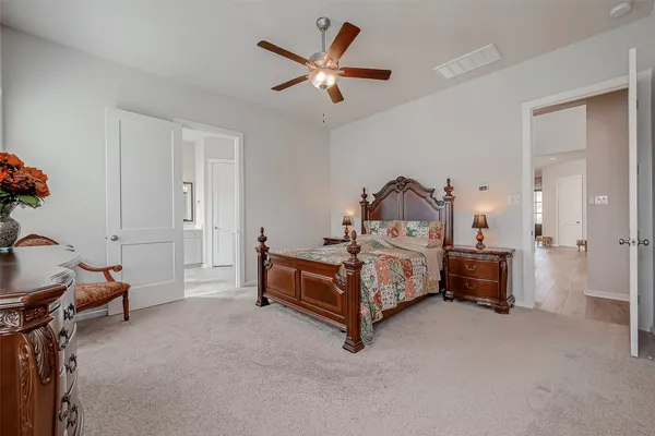a bedroom with a bed and a tv