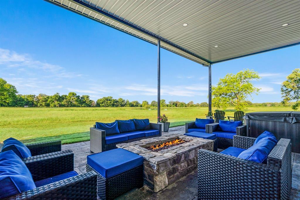 962 County Road Pattonville, TX 75468 - Photo 31 of 37 a outdoor living space with furniture and city view