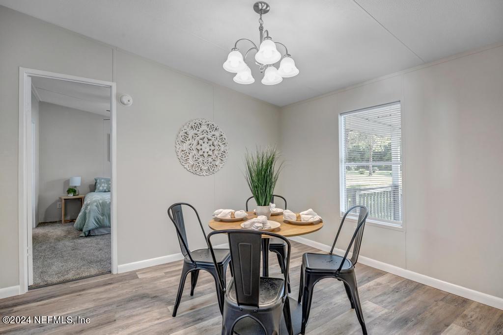 5557 Acadia Street Keystone Heights, FL 32656 - Photo 15 of 32 a dining room with furniture and window