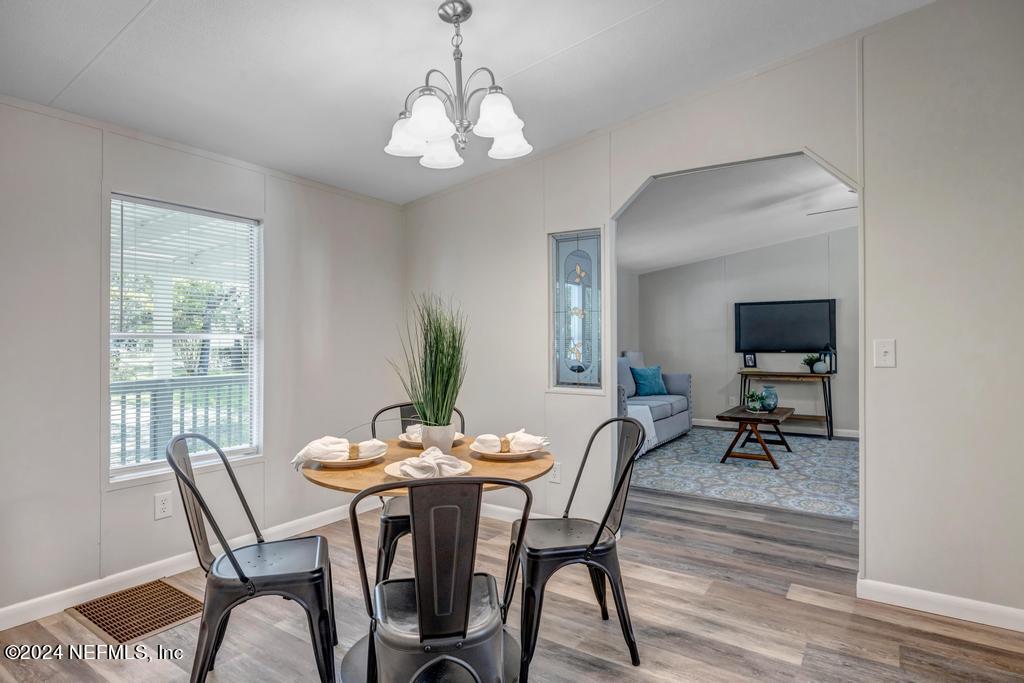 5557 Acadia Street Keystone Heights, FL 32656 - Photo 16 of 32 a view of a dining room with furniture and window