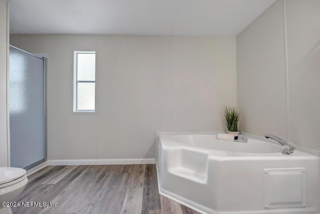 5557 Acadia Street Keystone Heights, FL 32656 - Photo 21 of 32 a bathroom with a sink and toilet