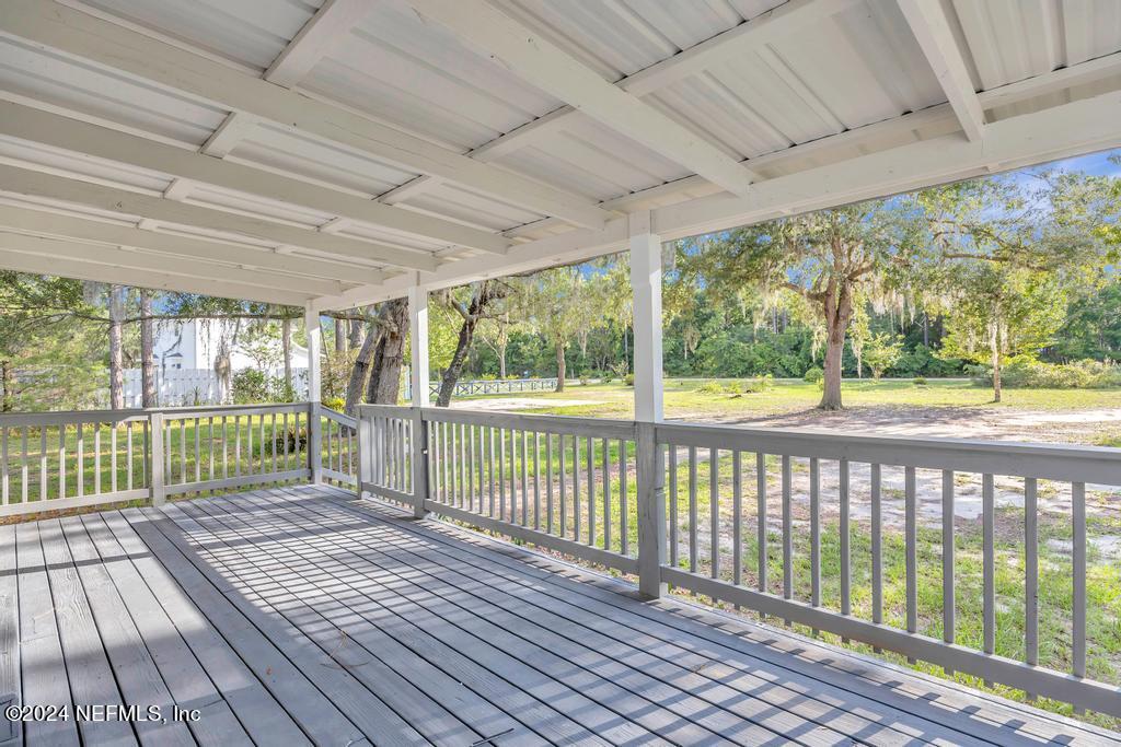 5557 Acadia Street Keystone Heights, FL 32656 - Photo 5 of 32 a view of a balcony with wooden floor