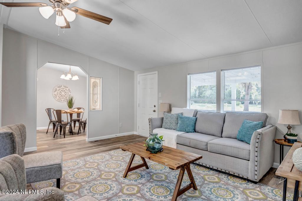 5557 Acadia Street Keystone Heights, FL 32656 - Photo 8 of 32 a living room with furniture and a large window