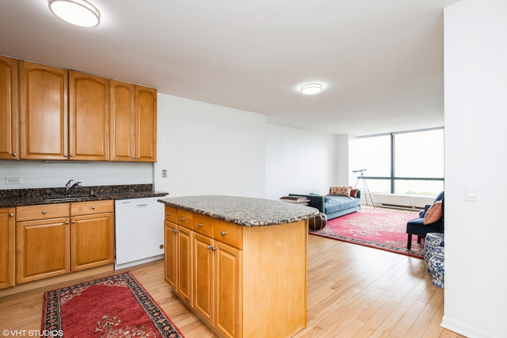 5415 North Sheridan Road, Unit 1504 Chicago, IL 60640 - Photo 3 of 21 a kitchen with stainless steel appliances granite countertop a sink stove and cabinets