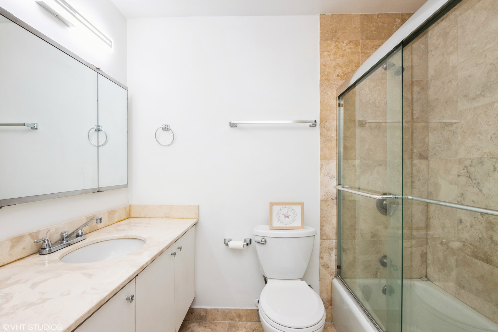 5415 North Sheridan Road, Unit 1504 Chicago, IL 60640 - Photo 10 of 21 a bathroom with a granite countertop sink toilet and shower