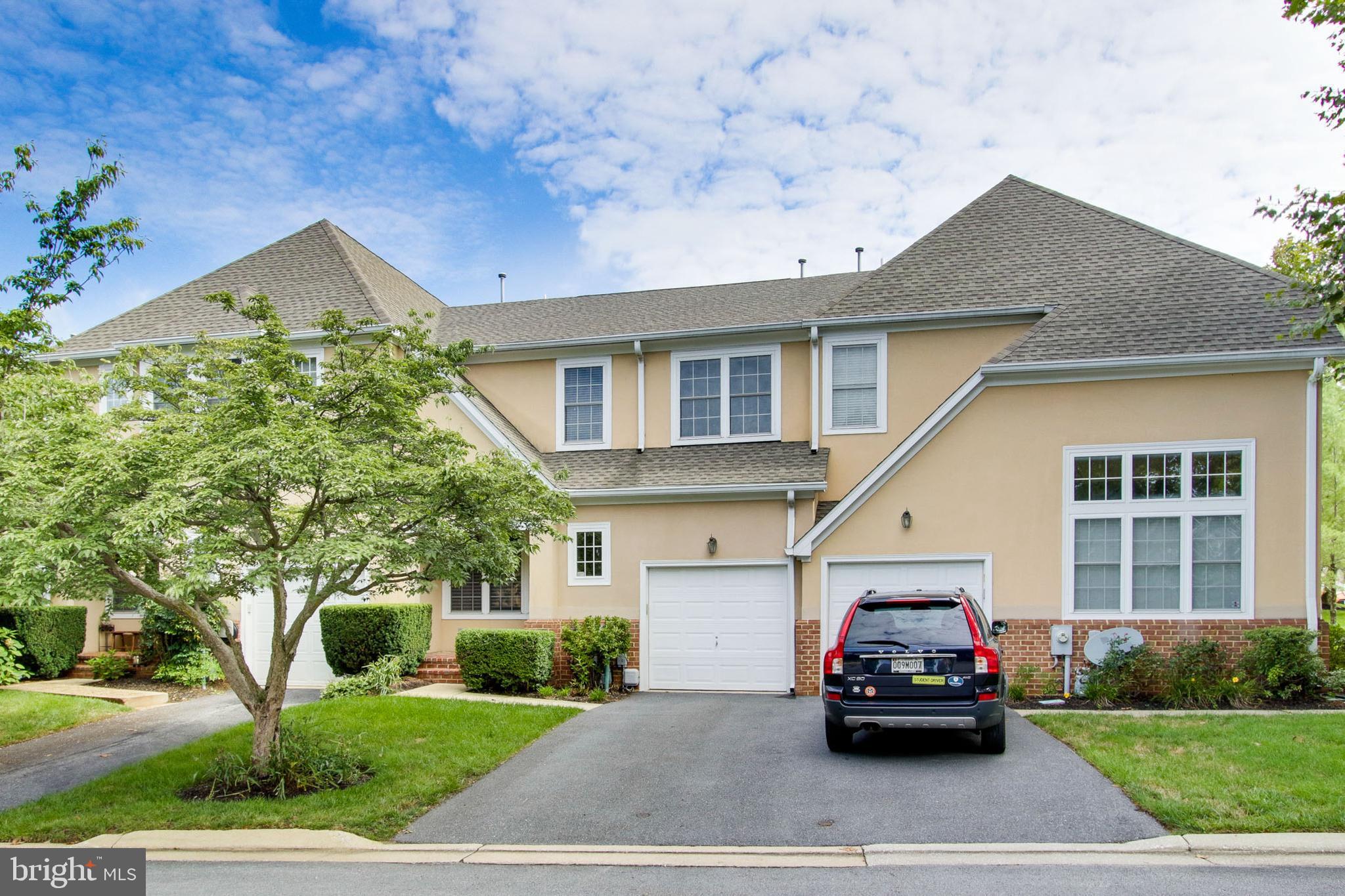 8818 Howard Forest Lane Baltimore, MD 21208 - Photo 1 of 31 a car parked in front of a house