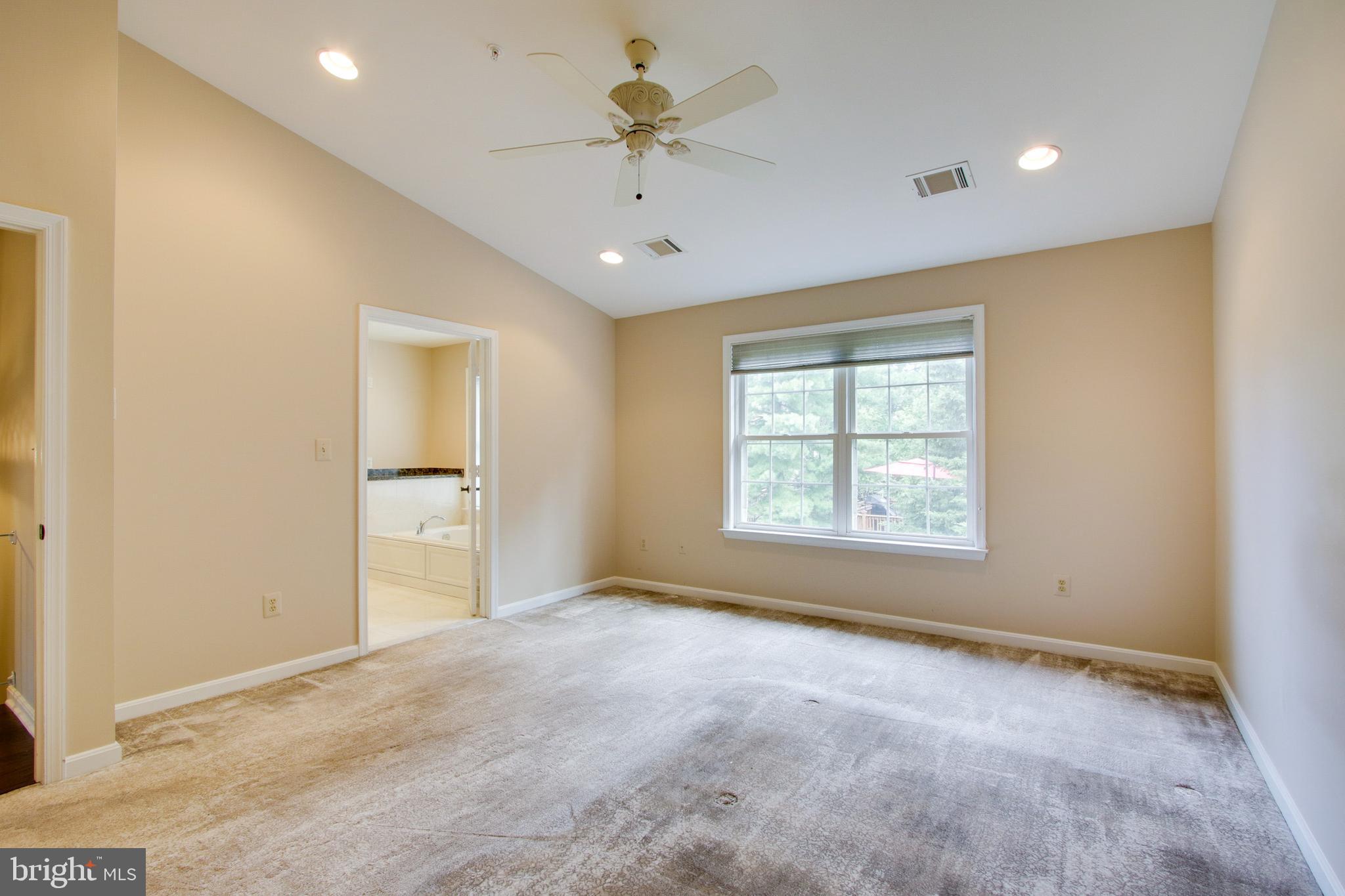 8818 Howard Forest Lane Baltimore, MD 21208 - Photo 17 of 31 a view of an empty room with a window