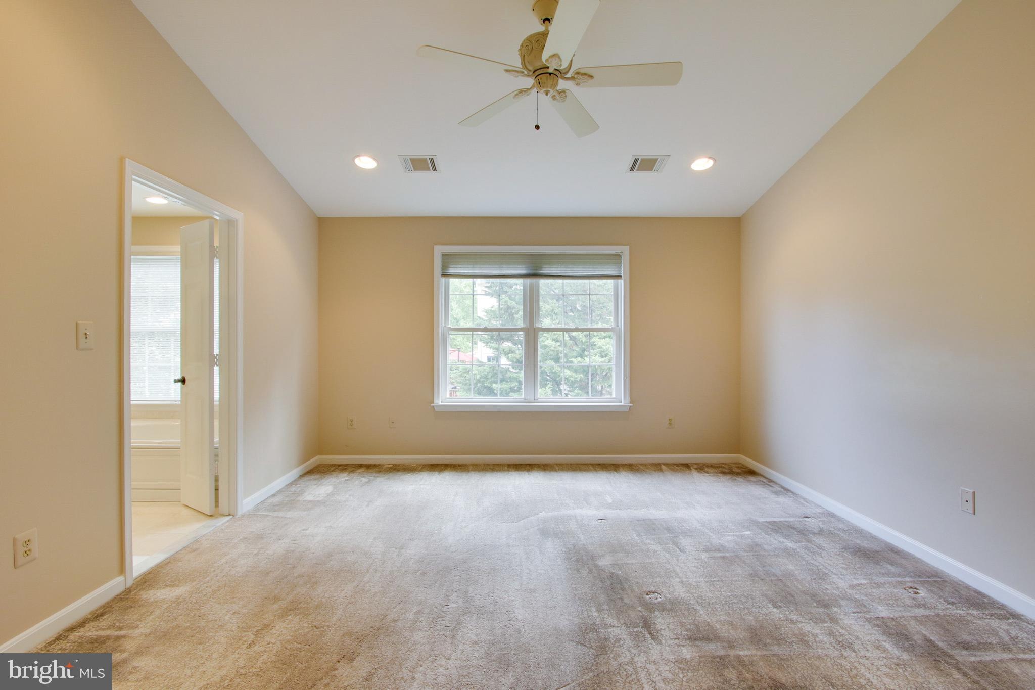 8818 Howard Forest Lane Baltimore, MD 21208 - Photo 18 of 31 a view of an empty room with a window